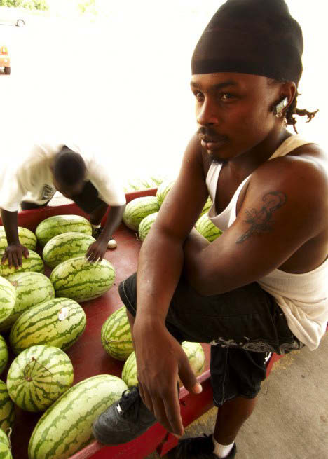 Man in market with fruit